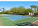 Well-maintained basketball and tennis court surrounded by mature trees and lush landscaping at 6648 E Horseshoe Rd, Paradise Valley, AZ 85253