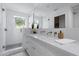 Bright bathroom featuring a marble vanity and glass-enclosed shower with neutral tile at 6648 E Horseshoe Rd, Paradise Valley, AZ 85253