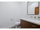 Stylish powder room featuring modern vanity, decorative tile floor and a sleek, rectangular mirror at 6648 E Horseshoe Rd, Paradise Valley, AZ 85253