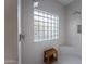 Bright bathroom showcasing tiled walls, glass block window, and bench at 6648 E Horseshoe Rd, Paradise Valley, AZ 85253