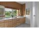 Bathroom with double vanity, wood detail and lots of natural light at 6648 E Horseshoe Rd, Paradise Valley, AZ 85253