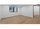 Bright bedroom with hardwood floors and a large window providing natural light at 6648 E Horseshoe Rd, Paradise Valley, AZ 85253