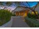 Charming front entrance with a stone walkway and wood detailing, framed by lush greenery at 6648 E Horseshoe Rd, Paradise Valley, AZ 85253