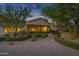 Stunning home exterior with well-manicured landscaping, walkway, and tasteful architectural design at 6648 E Horseshoe Rd, Paradise Valley, AZ 85253