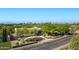 Exterior view of a home showcasing desert landscaping, mature trees, and mountain views at 6648 E Horseshoe Rd, Paradise Valley, AZ 85253