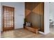 Bright foyer featuring custom millwork, modern bench, and stylish design elements at 6648 E Horseshoe Rd, Paradise Valley, AZ 85253