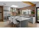 Open kitchen featuring a brick wall, stainless steel appliances, and an island with bar seating at 6648 E Horseshoe Rd, Paradise Valley, AZ 85253