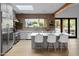 Spacious kitchen with a large island, stainless steel appliances, and natural light from a skylight at 6648 E Horseshoe Rd, Paradise Valley, AZ 85253