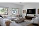 Bright living room with a comfortable sectional sofa, large windows, and modern decor at 6648 E Horseshoe Rd, Paradise Valley, AZ 85253