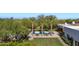 Aerial view of the beautiful pool surrounded by palm trees, lounge chairs, and lush landscaping at 6648 E Horseshoe Rd, Paradise Valley, AZ 85253
