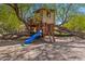 Charming treehouse with a slide and ladder, nestled among mature trees and greenery at 6648 E Horseshoe Rd, Paradise Valley, AZ 85253