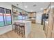 Modern kitchen with a breakfast bar, stainless steel appliances, and recessed lighting at 753 W Pampa Ave, Mesa, AZ 85210