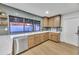 This home has a bright kitchen with light wood cabinets, stone countertops, and stainless steel appliances at 753 W Pampa Ave, Mesa, AZ 85210