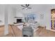 Inviting living room with a cozy fireplace, hardwood floors, and ample natural light at 753 W Pampa Ave, Mesa, AZ 85210