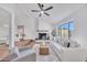 Spacious living room featuring hardwood floors, modern decor, and a cozy fireplace at 753 W Pampa Ave, Mesa, AZ 85210