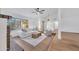Open-concept living room with hardwood floors, modern lighting, and comfortable seating at 753 W Pampa Ave, Mesa, AZ 85210