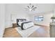 This spacious main bedroom features a vaulted ceiling, ceiling fan, and large window at 753 W Pampa Ave, Mesa, AZ 85210