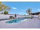 Backyard featuring a sparkling pool, patio area, and secure perimeter fence at 753 W Pampa Ave, Mesa, AZ 85210
