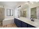 Bathroom featuring a soaking tub, glass-enclosed shower, and a dual sink vanity with modern fixtures at 7565 N Vía De La Siesta --, Scottsdale, AZ 85258