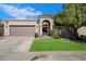 Charming home featuring an inviting gated entry, well-maintained lawn, and a convenient two-car garage at 7565 N Vía De La Siesta --, Scottsdale, AZ 85258
