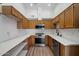 Well-lit kitchen featuring stainless steel appliances, ample wood cabinetry, and bright white countertops at 7565 N Vía De La Siesta --, Scottsdale, AZ 85258