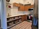 Efficient kitchen featuring stainless steel appliances, wooden cabinetry, and ample counter space at 7565 N Vía De La Siesta --, Scottsdale, AZ 85258