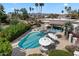 Upscale neighborhood pool and lounge area with mature trees and landscaping at 7565 N Vía De La Siesta --, Scottsdale, AZ 85258