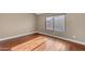 Sun-lit bedroom featuring hardwood floors and large windows at 7835 E Glenrosa Ave # 13, Scottsdale, AZ 85251