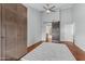 Spacious bedroom with wood floors, ceiling fan and barn door to the bathroom at 7835 E Glenrosa Ave # 13, Scottsdale, AZ 85251