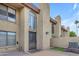 Exterior facade with stone accents and iron gate at 7835 E Glenrosa Ave # 13, Scottsdale, AZ 85251