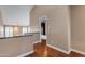 Upstairs hallway with wood floors and an open view of living space at 7835 E Glenrosa Ave # 13, Scottsdale, AZ 85251