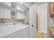 Laundry room includes cabinetry and washer and dryer at 7835 E Glenrosa Ave # 13, Scottsdale, AZ 85251
