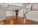Bright living space with hardwood floors, neutral walls, and an open layout that flows into the kitchen and staircase at 7835 E Glenrosa Ave # 13, Scottsdale, AZ 85251