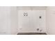 Utility room featuring washer and dryer hookups on bright, white walls at 8037 W Mohave St, Phoenix, AZ 85043