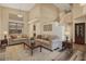 Bright living room with neutral tones, hardwood floors, and a cozy seating area at 8037 W Mohave St, Phoenix, AZ 85043