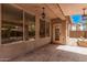 Covered patio area featuring patterned stone floors and multiple windows at 8037 W Mohave St, Phoenix, AZ 85043