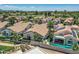 This aerial shows a golf course community with pools, lush landscaping, and beautiful homes at 8136 E Cortez Dr, Scottsdale, AZ 85260