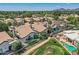Aerial showcasing properties with mature desert landscaping, pools, and golf course access at 8136 E Cortez Dr, Scottsdale, AZ 85260
