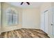Bedroom features modern floors, large window and closet at 8136 E Cortez Dr, Scottsdale, AZ 85260