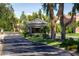 Picturesque guard house entrance with mature landscaping and trees leads into the community at 8136 E Cortez Dr, Scottsdale, AZ 85260
