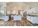 Spacious, updated kitchen features stainless appliances, white cabinetry, and granite countertops at 8136 E Cortez Dr, Scottsdale, AZ 85260