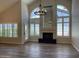 Spacious living room features a fireplace, high ceilings, and bright windows with shutters at 8136 E Cortez Dr, Scottsdale, AZ 85260