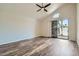 Bright living room features wood floors, high ceilings, and sliding glass doors to a patio at 8136 E Cortez Dr, Scottsdale, AZ 85260