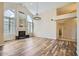 Bright living room features a sleek fireplace, wood-look floors and large windows at 8136 E Cortez Dr, Scottsdale, AZ 85260