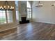Bright living room features laminate flooring, high ceilings, and a fireplace at 8136 E Cortez Dr, Scottsdale, AZ 85260