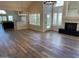 Open floor plan with lots of natural light, fireplace, and wood laminate flooring at 8136 E Cortez Dr, Scottsdale, AZ 85260