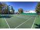 Inviting tennis courts surrounded by mature trees for a scenic play experience at 8136 E Cortez Dr, Scottsdale, AZ 85260
