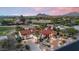 Stunning aerial view of the home, showcasing desert landscaping and a mountain backdrop at 8514 E Country Club Trl, Scottsdale, AZ 85255