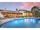 Beautiful backyard with a sparkling pool, lush landscaping, and covered patio perfect for outdoor living at 8514 E Country Club Trl, Scottsdale, AZ 85255