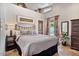 Cozy bedroom with comfortable furnishings, large window, and stylish decor at 8514 E Country Club Trl, Scottsdale, AZ 85255